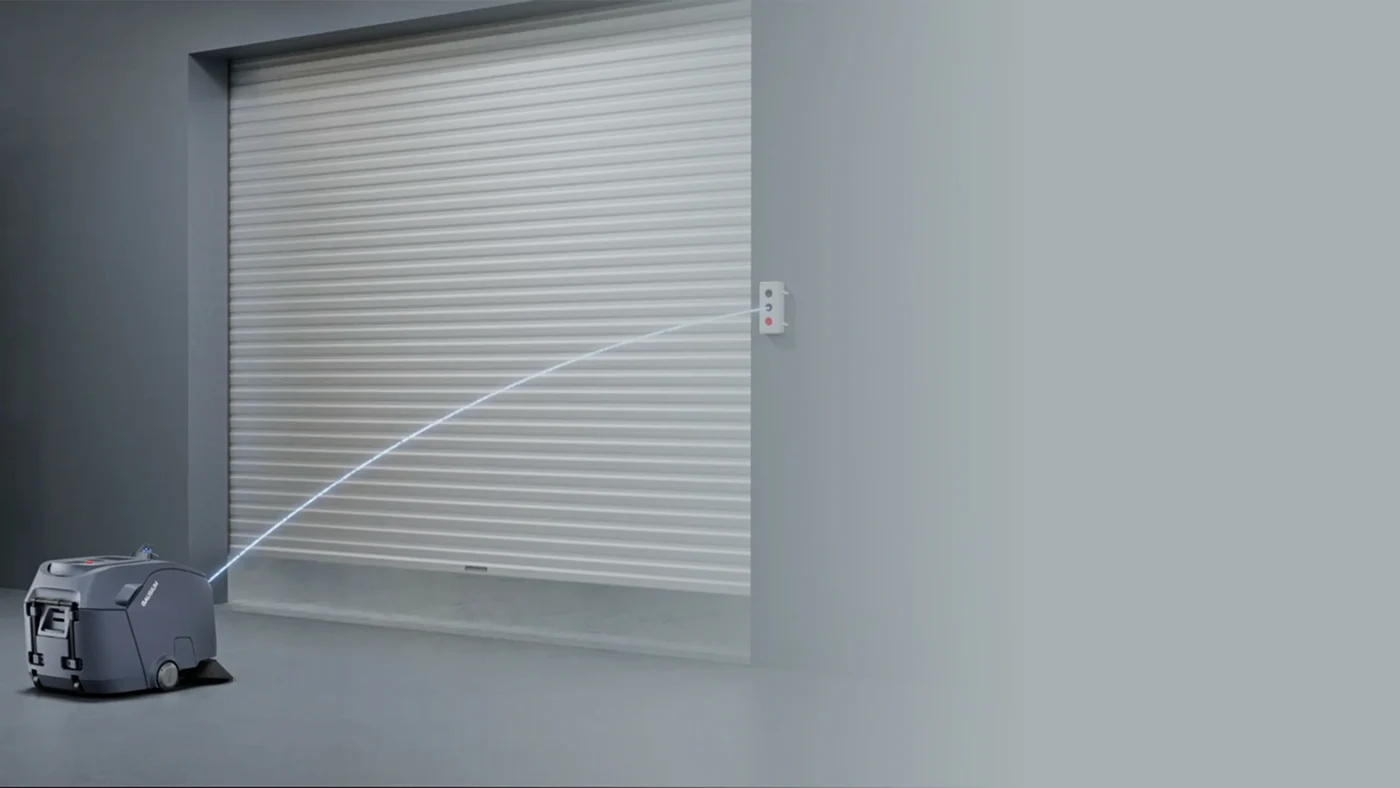 Gausium Beetle approaching a warehouse door using AutoPass