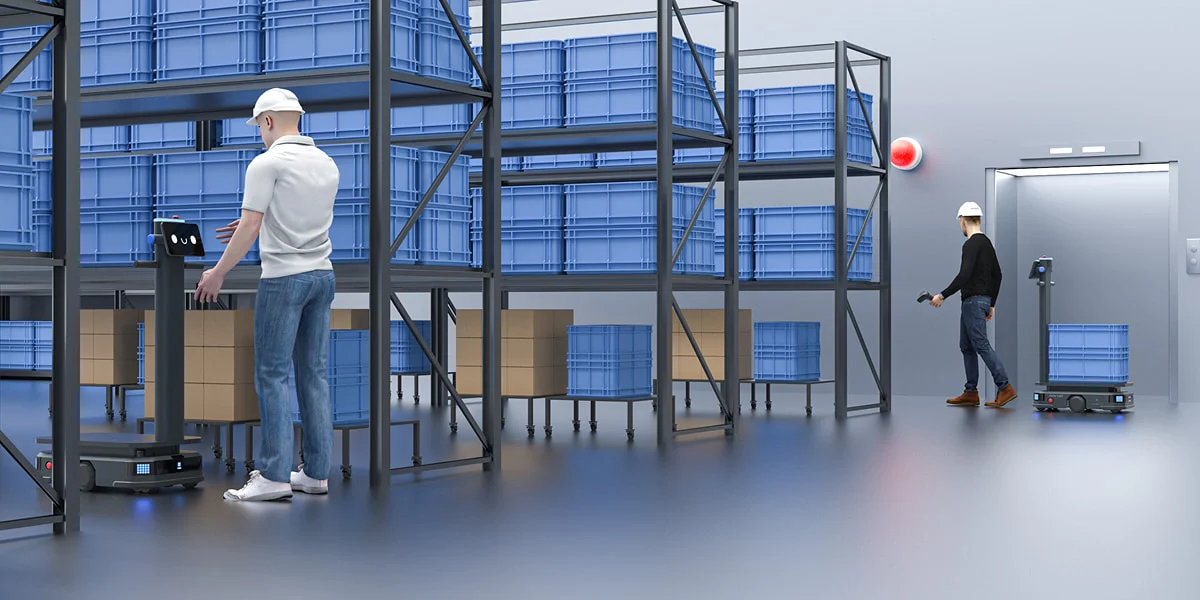 An operator guides setup in a warehouse environment.