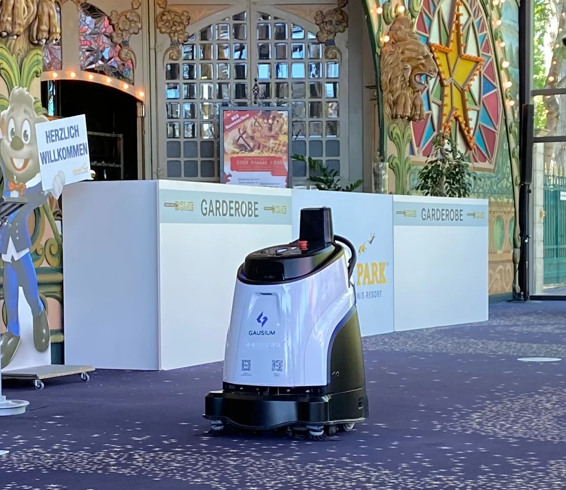 Gausium Vacuum 40 operating on patterned carpet in a lobby