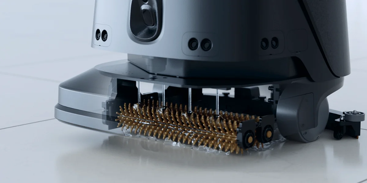 Close-up of the cleaning brush assembly on a PUDU CC1 Pro